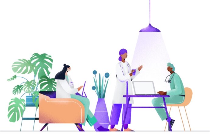 Three doctors in white coats are having a meeting. One is seated on a couch, another stands near a table, and the third sits at a table with a laptop under a hanging lamp.