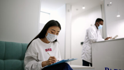 college student with mask at clinic