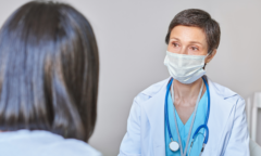 female doctor speaking with female patient