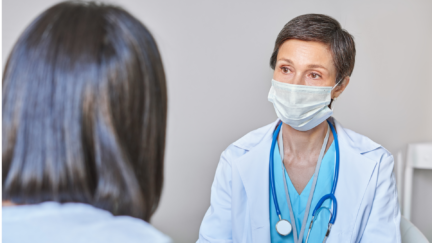 female doctor speaking with female patient