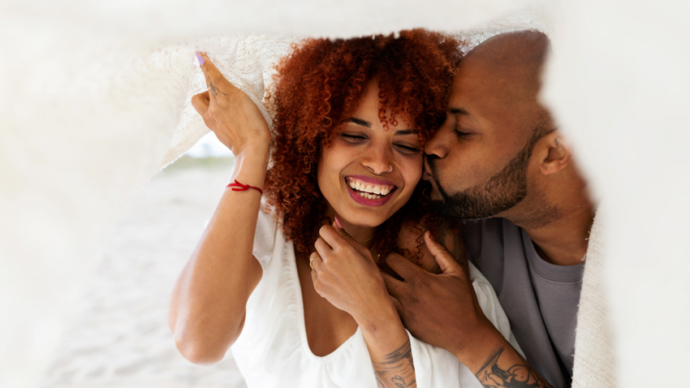 male and female couple happy and kissing