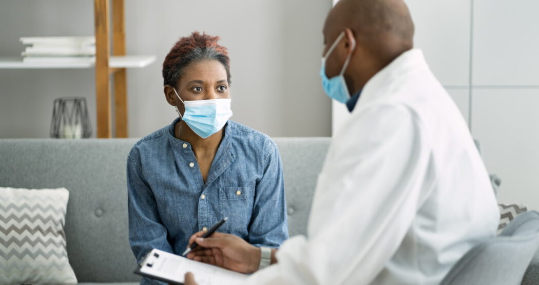 doctor speaking with patient to retain her as a customer of his medical practice