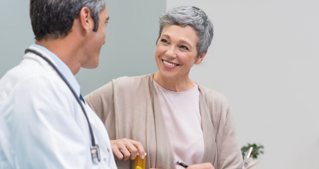 doctor speaking with patient to get feedback on their level of satisfaction with their medical visit