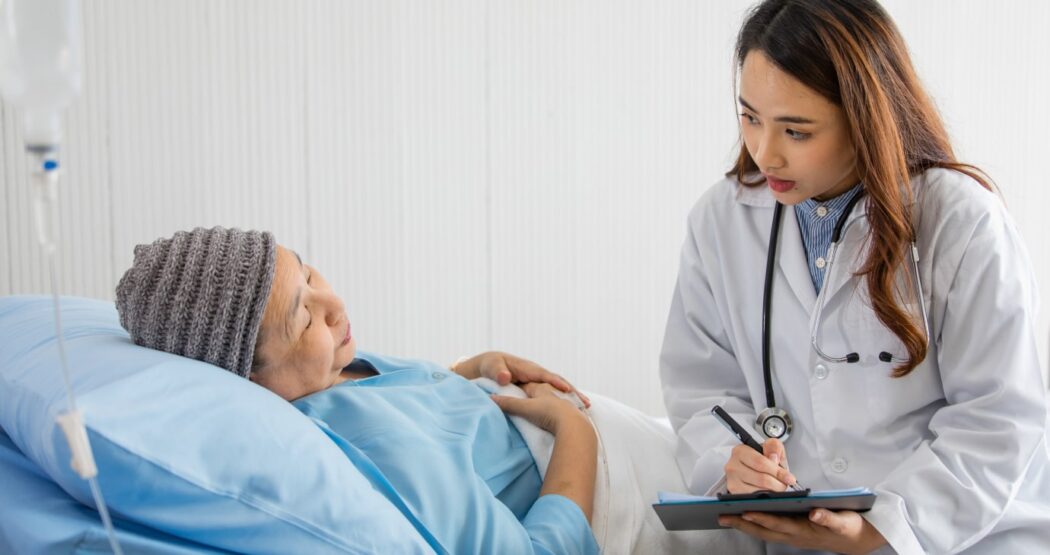 patient in hospital being asked questions in a patient satisfaction survey