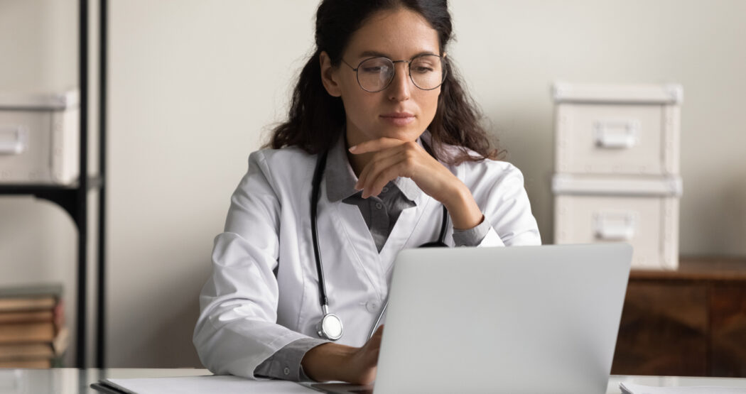 A doctor receiving paid online surveys for medical professionals