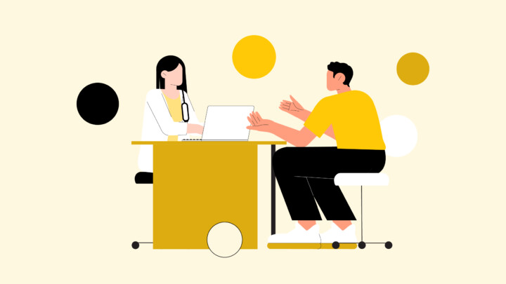 Illustration of two people sitting across a desk, one using a laptop and wearing a stethoscope—suggesting a consultation or meeting about primary care physician side gigs—with abstract circles in the background.