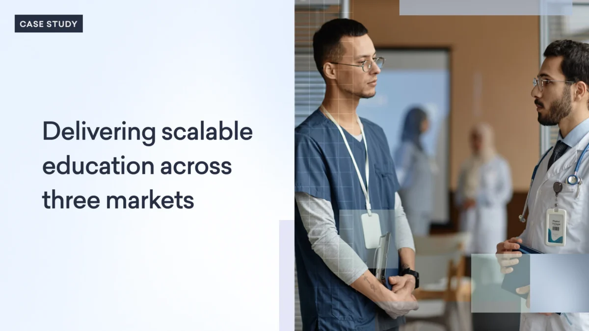 Two men wearing medical ID badges and scrubs converse in a professional setting; text reads, "Delivering scalable PCP education across three markets.